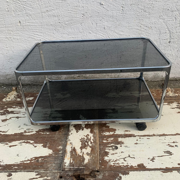 Vintage Space Age Beistelltisch Stahlrohr Rauchglas auf Rollen