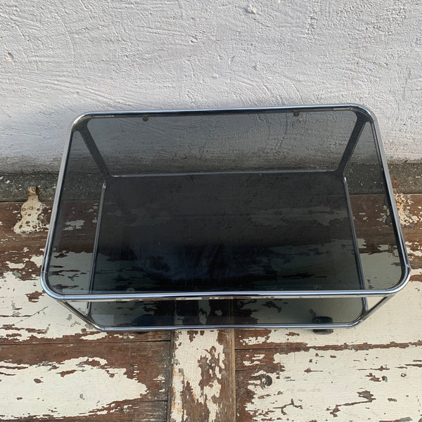Vintage Space Age Beistelltisch Stahlrohr Rauchglas auf Rollen