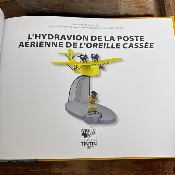 Modell Figur und Buch Tim und Struppi das gelbe Flugboot der Luftpost mit Alonzo Perez aus Die zerbrochene Ohrmuschel