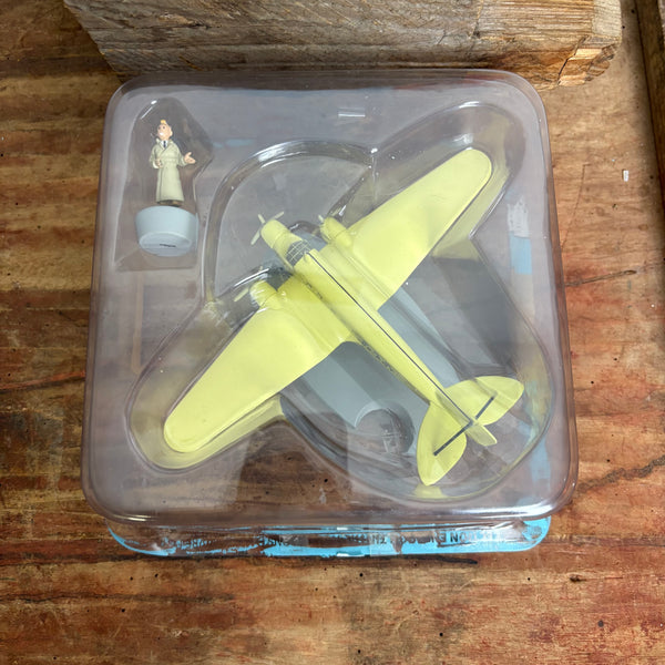 Modell Figur und Buch Tim und Struppi Das gelbe Flugzeug der Sabena mit Tim aus Die Schwarze Insel