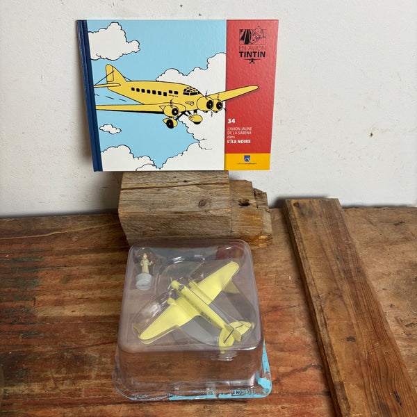 Modell Figur und Buch Tim und Struppi Das gelbe Flugzeug der Sabena mit Tim aus Die Schwarze Insel