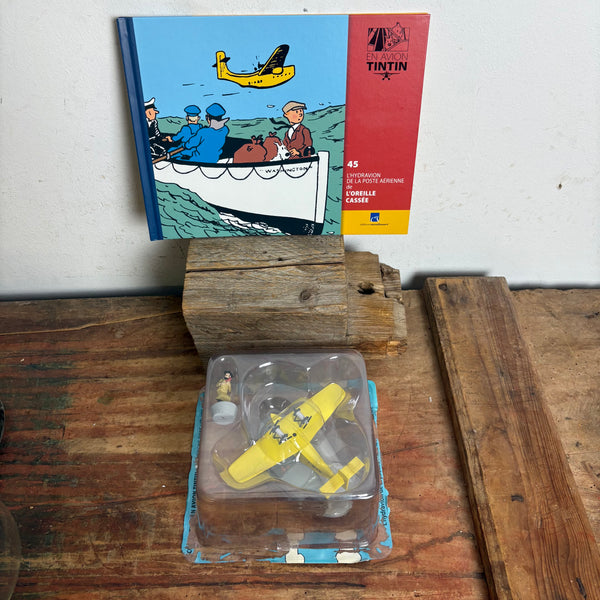 Modell Figur und Buch Tim und Struppi das gelbe Flugboot der Luftpost mit Alonzo Perez aus Die zerbrochene Ohrmuschel