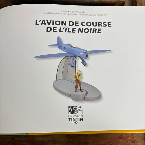 Modell Figur und Buch Tim und Struppi Das blaue Rennflugzeug mit Tim aus Die Schwarze Insel